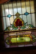 ANTIQUE STAINED GLASS 43 X 49 HAS DAMAGE CRACKED GLASS AND CHIP MISSING