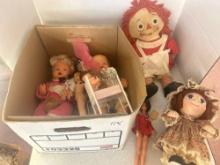 assortment of dolls