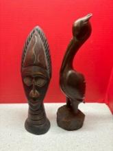 two hand carved wooden figures