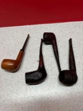 four vintage pipes