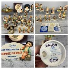 Group of Vintage Hummel Figurines, Plaques, and Store Display Dealer Sign