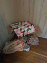 Group of vintage quilts and bedding