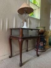 traditional cherry end table with antique lamp